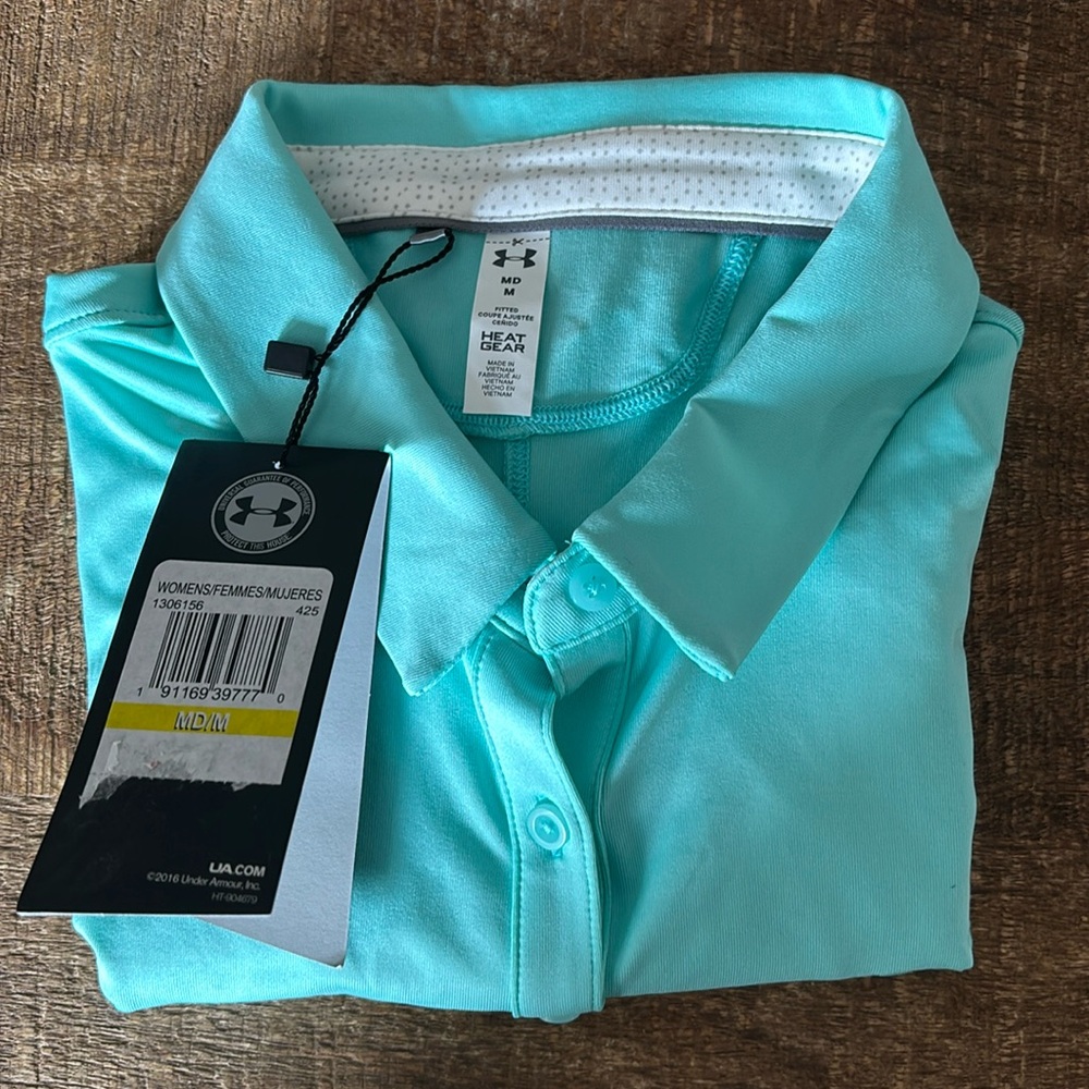 Under Armor sleeveless polo. Brand new but doesn’t have the tags.